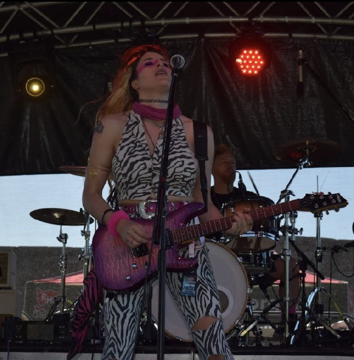 Guitarist and singer performing live on stage